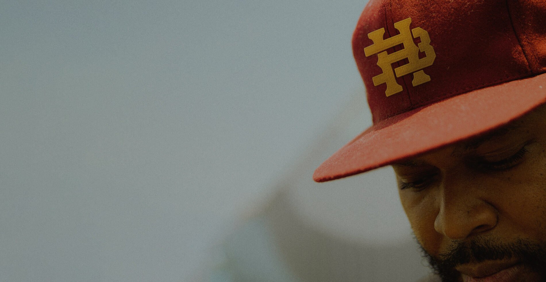 Bay Hills Church hat designed by BLVR, shown on member to showcase belief-driven church branding in action